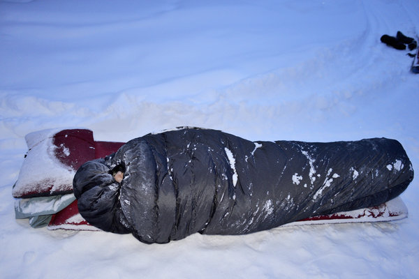 Winter camping, sleeping in snow, Alaska.