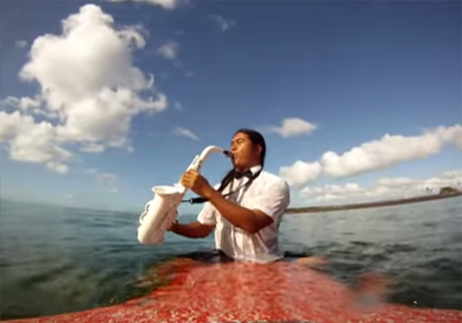 Reggie Padilla Plays Saxophone While Surfing
